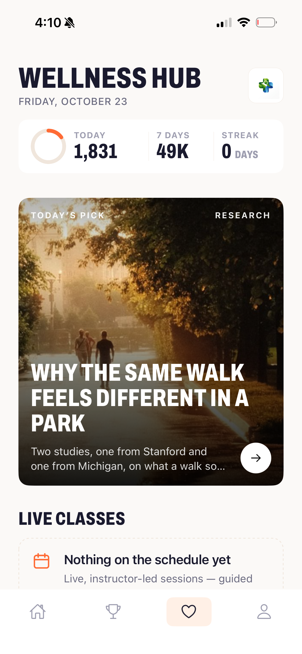 Wellness Hub tab showing today's steps, seven-day total and streak above a photo card for today's pick, a research read on walking in a park